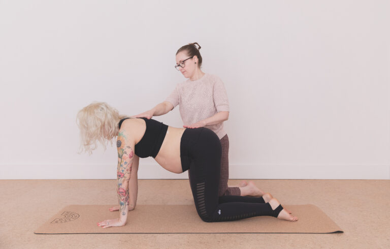 Dr Kimberley and pregnant client yoga position